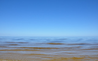 Ocean shore beach blue sky - a few wave free wallpaper