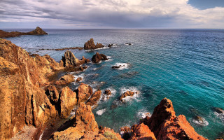 Rocky coast mountainous horizon ocean - the rock free wallpaper