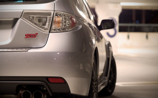 Car tail light side mirror - a close up of a car free wallpaper