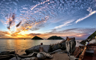 Sunset beach mountains clouds puzzle - a sunset view of a beach free wallpaper