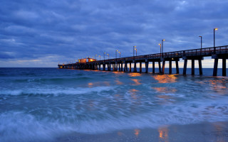 Pier ocean cloudy night lights - the ocean under a cloudy sky free wallpaper