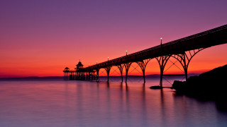 Pier sunset purple sky reflection - rich moody colour free wallpaper