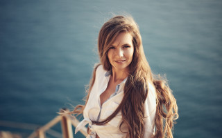 Woman longhair dock water smiling - flowing hair free wallpaper