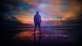 Beach surfboard man colorful sky - free beach wallpaper