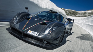 Black sports car mountain snow - a mountain side free wallpaper