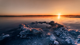 Sunset water ice rocks birds - a few bird free wallpaper