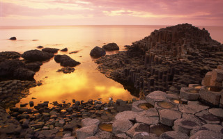 Rocky beach water rock formation 2 - a sunset in the background free wallpaper