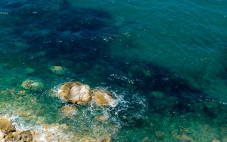 Water rocks boat person impressionist - a body of water free wallpaper for desktop
