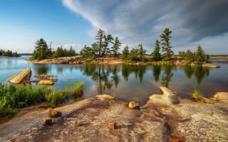 Lake forest rocks cloudy sky - derek chittock free wallpaper