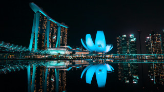 Adrian zingg building cityscape night - side and a city in the background free wallpaper