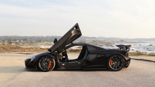 Black sports car ocean beach - f 8 aperture free wallpaper
