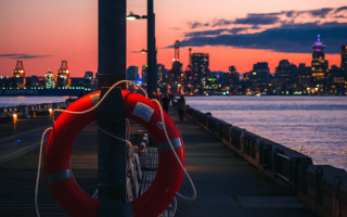Life preserver pole sunset cityscape - a life preserver free wallpaper