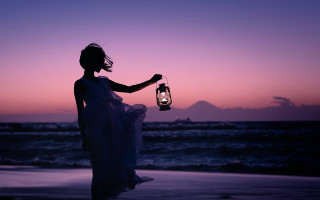Woman lantern beach sunset mountain - a white dress holding free wallpaper