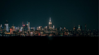 City skyline night plane water - a body of water below free wallpaper