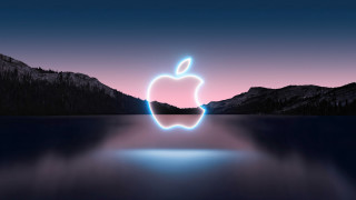 Apple logo night sky mountains - the background and a lake in the foreground free wallpaper