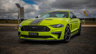 Bright yellow mustang parking lot - cloudy free wallpaper