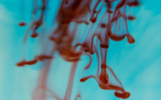 Red liquid blue background blood - action painting free wallpaper