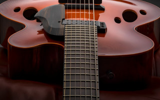 Guitar brown body flemish baroque - a close up of a guitar free wallpaper