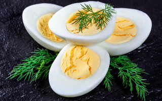 Three eggs green sprig black - top of them free wallpaper