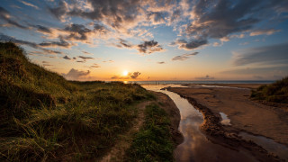Sunset water grassy bank dusk - sunset free wallpaper