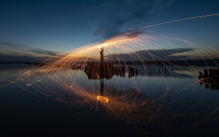 Person dock firework water city - free new year wallpaper