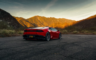 Red sports car mountains sunset 3 - a parking lot free wallpaper