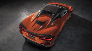 Orange sports car above dark - side profile free wallpaper