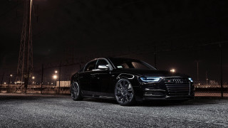 Black car parking lot night 4 - a street light in the background free wallpaper