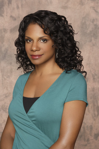 Woman curly hair blue top - a portrait free wallpaper