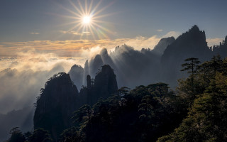 Mountain sun fog beach cityscape - crepuscular ray free wallpaper