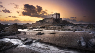 Lighthouse rocky shore sunset cityscape - a rocky shore free wallpaper