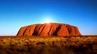 Large rock field sunshine blue - a blue sky free wallpaper