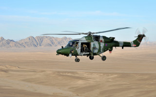 Helicopter desert mountains person cockpit - a helicopter free wallpaper