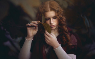 Woman leaf serious portrait blonde - a leaf free wallpaper