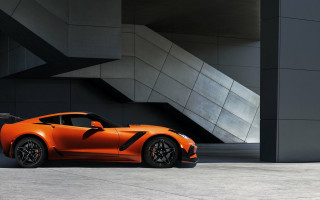 Orange sports car building staircase - side profile free wallpaper
