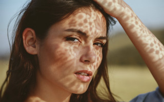 Freckled asian woman concerned photorealistic - her face and hair free wallpaper