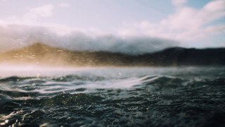 Blurry water mountain clouds ocean - impressionist free wallpaper