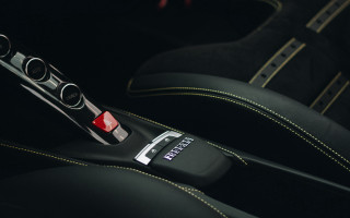 Car steeringwheel remote centerconsole black - a close up of a car free wallpaper