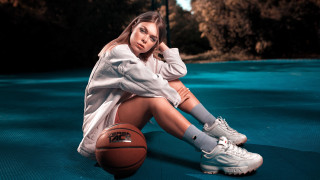 Woman basketball sitting outdoors portrait - a basketball free wallpaper