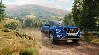 Blue car mountains dirt road - a hill in the background free wallpaper