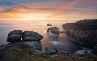 Rocky cliff sunset water boat - a rocky cliff free wallpaper