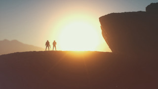 Cliff sunset silhouette retrofuturism beach - two person free wallpaper
