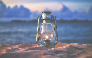 Lantern sand water clouds beach - free light wallpaper