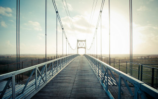 Bridge sunshine clouds water view - a bridge free wallpaper