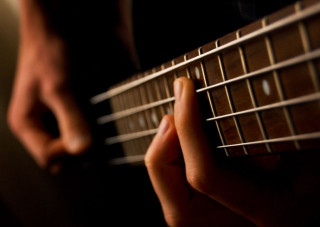Person playing guitar fingers strings - a person playing free wallpaper