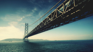 Bridge water mountain blue sky - a bridge over a body of water free wallpaper