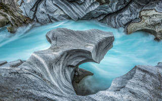 River rocks blue water fantasy - derold page free wallpaper