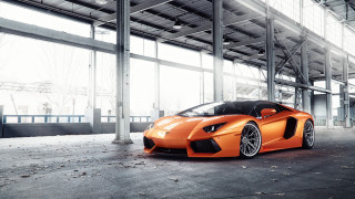 Orange sports car building windows - andrew law free wallpaper