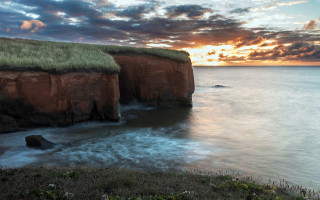 Grassy roof cliff ocean sunset - sunset free wallpaper