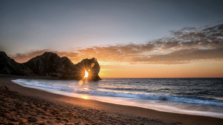 Sunset beach rock formation water 4 - a sunset free wallpaper for desktop